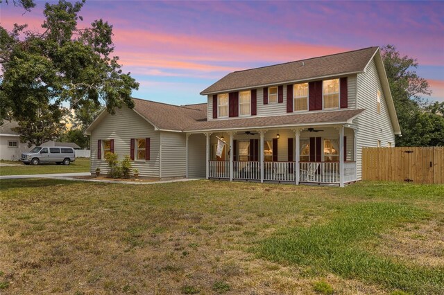 2512 Rustic Oaks Dr, Lutz, FL 33559 - view of front facade featuring ceiling fan, a porch, and a shingled roof
