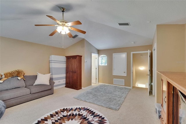 living area featuring ceiling fan, visible vents, light carpet, and lofted ceiling