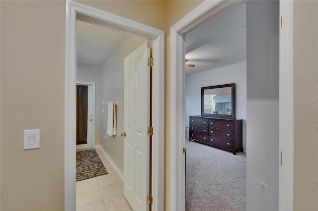 corridor featuring tile patterned flooring
