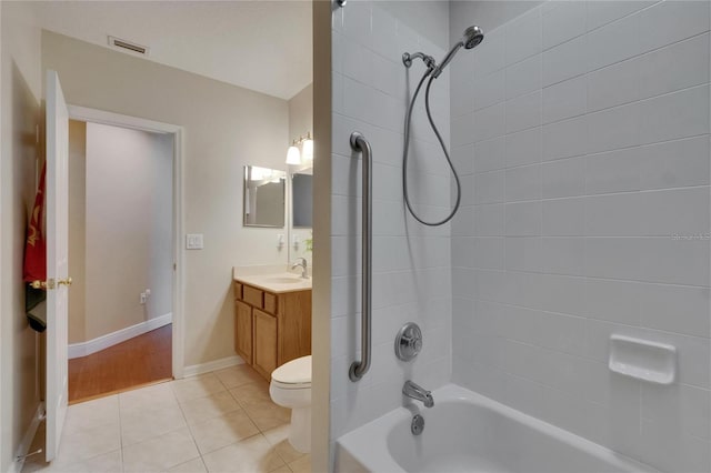 bathroom featuring visible vents, tile patterned flooring, vanity, toilet, and tub / shower combination