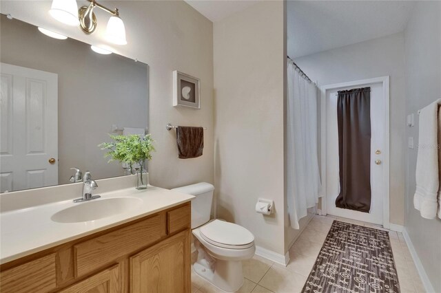 15724 Ibisridge Dr, Lithia, FL 33547 - full bathroom with toilet, a shower with shower curtain, tile patterned flooring, and vanity