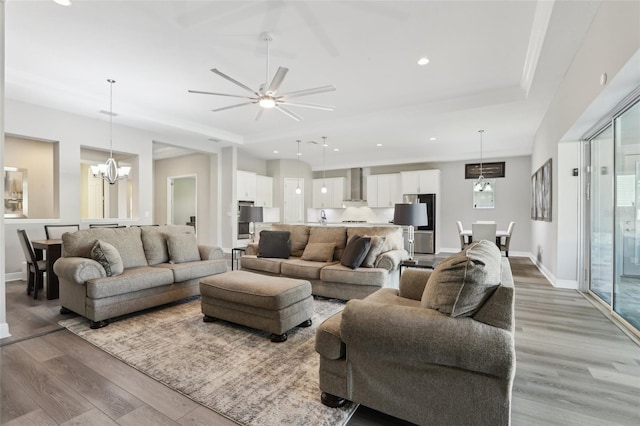 5477 Wayfarer Ave, Apollo Beach, FL 33572 - living room with light wood-style floors, a chandelier, recessed lighting, ceiling fan, and baseboards
