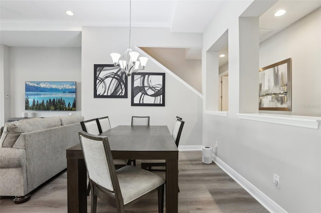 5477 Wayfarer Ave, Apollo Beach, FL 33572 - dining area featuring a chandelier, wood finished floors, recessed lighting, baseboards, and ornamental molding