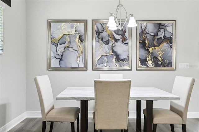 5477 Wayfarer Ave, Apollo Beach, FL 33572 - dining area with dark wood-style floors, a chandelier, and baseboards