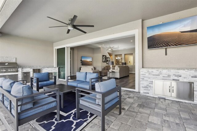 5477 Wayfarer Ave, Apollo Beach, FL 33572 - view of patio with an outdoor kitchen, a ceiling fan, an outdoor living space, and grilling area