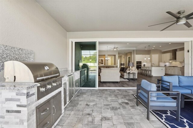 5477 Wayfarer Ave, Apollo Beach, FL 33572 - view of patio with area for grilling, an outdoor living space, ceiling fan, and a sink