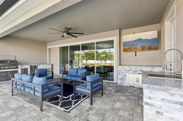5477 Wayfarer Ave, Apollo Beach, FL 33572 - view of patio featuring exterior kitchen, an outdoor living space, and a sink