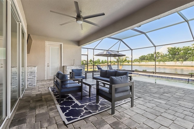5477 Wayfarer Ave, Apollo Beach, FL 33572 - view of patio featuring a water view, ceiling fan, outdoor lounge area, and glass enclosure