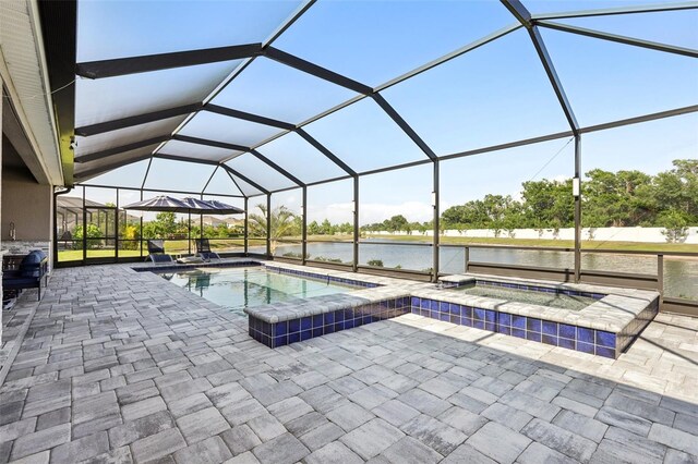 5477 Wayfarer Ave, Apollo Beach, FL 33572 - outdoor pool featuring an in-ground hot tub, a patio, a water view, and glass enclosure