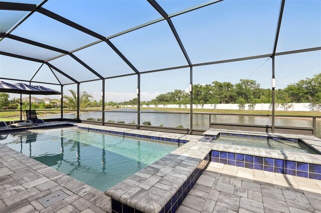 5477 Wayfarer Ave, Apollo Beach, FL 33572 - outdoor pool with a water view, an in-ground hot tub, glass enclosure, and a patio area