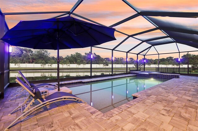 5477 Wayfarer Ave, Apollo Beach, FL 33572 - view of pool featuring a patio area, a lanai, a water view, and a pool with connected hot tub