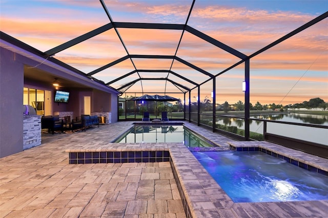 5477 Wayfarer Ave, Apollo Beach, FL 33572 - view of pool featuring a water view, a patio, a lanai, a pool with connected hot tub, and an outdoor living space
