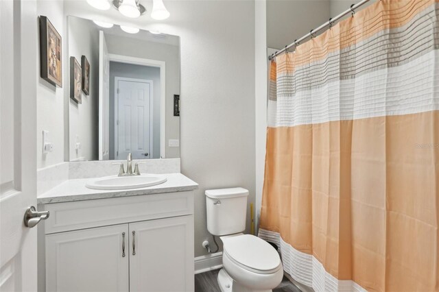 5477 Wayfarer Ave, Apollo Beach, FL 33572 - bathroom with vanity, toilet, and a shower with shower curtain