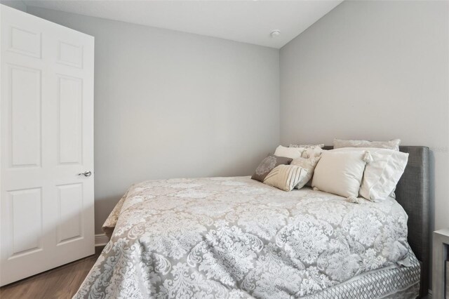 5477 Wayfarer Ave, Apollo Beach, FL 33572 - bedroom with dark wood-type flooring