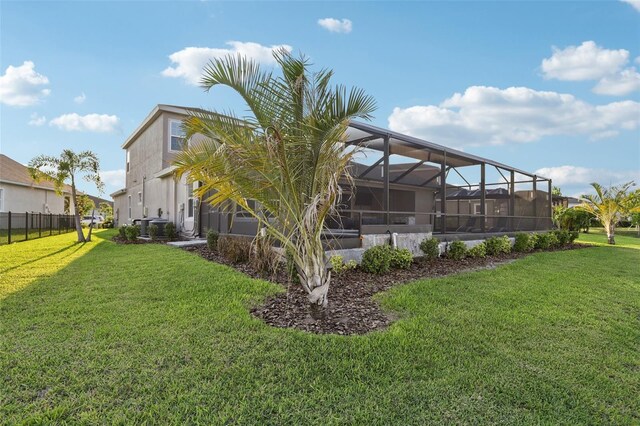 5477 Wayfarer Ave, Apollo Beach, FL 33572 - rear view of property featuring glass enclosure