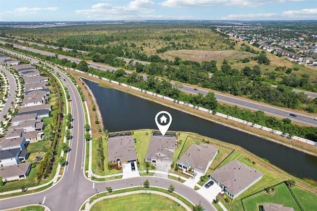 5477 Wayfarer Ave, Apollo Beach, FL 33572 - aerial view of property and surrounding area featuring a large body of water and nearby suburban area