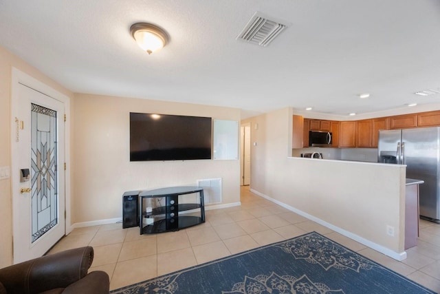 living room with light tile patterned flooring, baseboards, visible vents, and recessed lighting