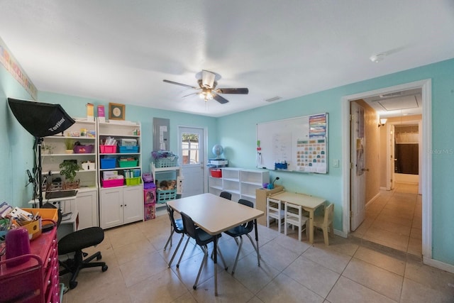 recreation room with visible vents, attic access, ceiling fan, and light tile patterned floors