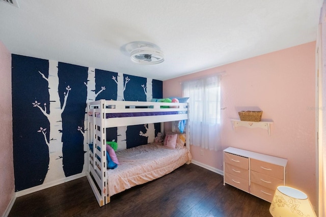 bedroom with baseboards, dark wood-style flooring, and visible vents