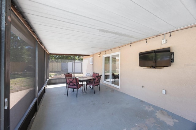 sunroom / solarium with outdoor dining area