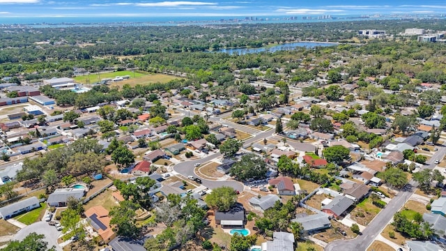 bird's eye view with a water view and a residential view