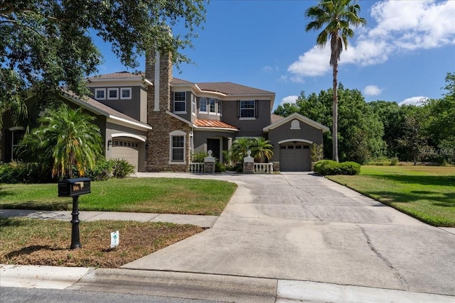 16637 Ashton Green Dr, Lutz, FL 33558 - view of front of property featuring an attached garage, a front lawn, stone siding, stucco siding, and concrete driveway