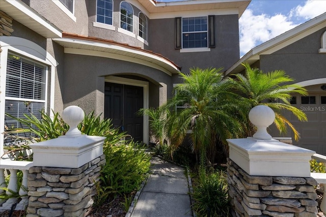 16637 Ashton Green Dr, Lutz, FL 33558 - doorway to property with stucco siding