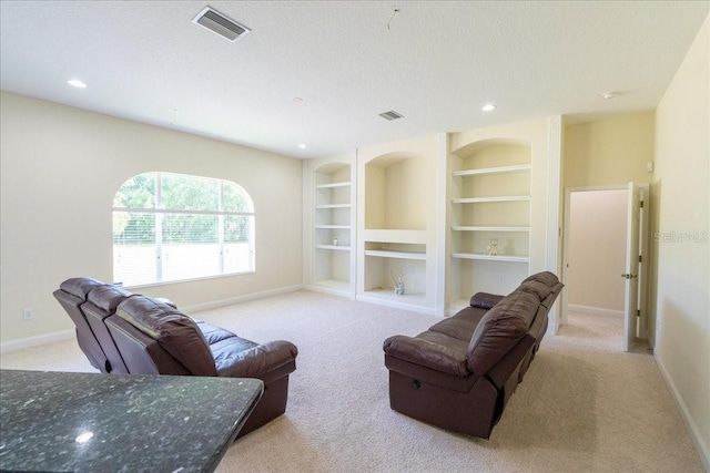 16637 Ashton Green Dr, Lutz, FL 33558 - carpeted living area with baseboards, visible vents, and built in features