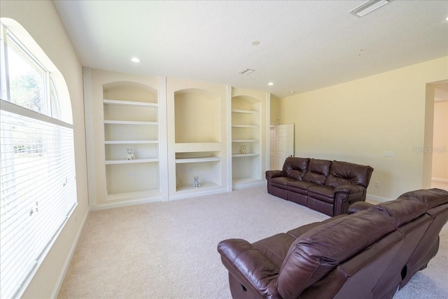 16637 Ashton Green Dr, Lutz, FL 33558 - carpeted living room with visible vents, recessed lighting, baseboards, and built in shelves