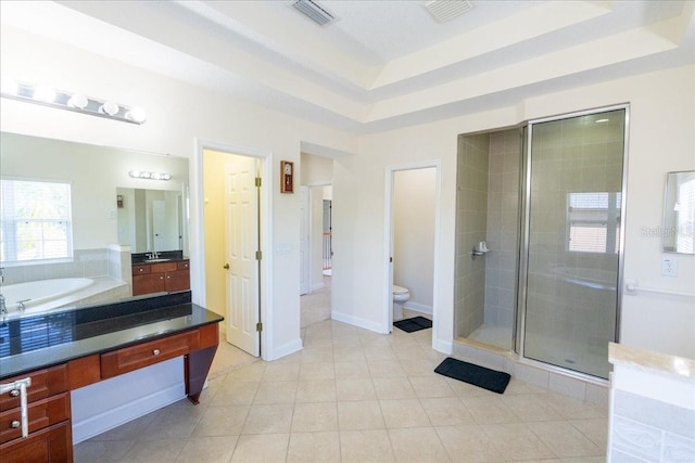 16637 Ashton Green Dr, Lutz, FL 33558 - full bath featuring visible vents, a stall shower, vanity, toilet, and a tray ceiling