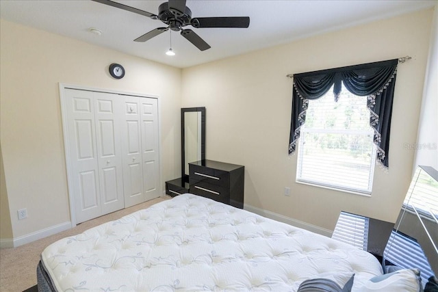 16637 Ashton Green Dr, Lutz, FL 33558 - carpeted bedroom featuring a closet, a ceiling fan, baseboards, and multiple windows