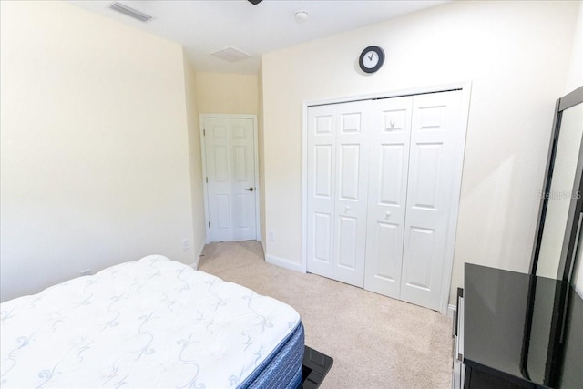 16637 Ashton Green Dr, Lutz, FL 33558 - bedroom featuring light colored carpet, visible vents, and a closet