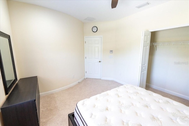 16637 Ashton Green Dr, Lutz, FL 33558 - bedroom with visible vents, a closet, baseboards, ceiling fan, and light colored carpet
