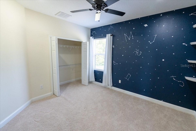 16637 Ashton Green Dr, Lutz, FL 33558 - unfurnished bedroom featuring carpet, a ceiling fan, baseboards, visible vents, and a closet