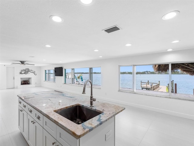 326 176th Avenue Cir, Redington Shores, FL 33708 - kitchen featuring a sink, open floor plan, healthy amount of natural light, recessed lighting, and a fireplace