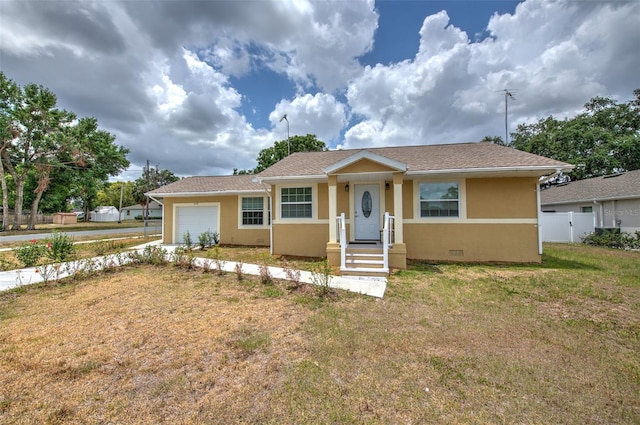 5939 14th St, Zephyrhills, FL 33542 - view of front of home with fence, a garage, stucco siding, a front yard, and driveway