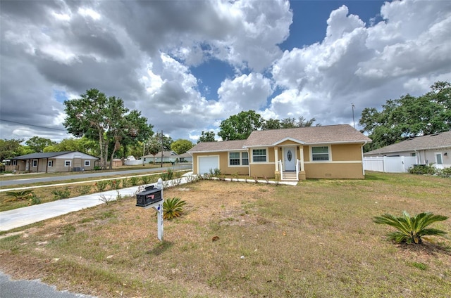 5939 14th St, Zephyrhills, FL 33542 - bungalow featuring fence, a front lawn, a garage, stucco siding, and driveway