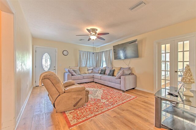 5939 14th St, Zephyrhills, FL 33542 - living area with a ceiling fan, visible vents, plenty of natural light, and light wood finished floors