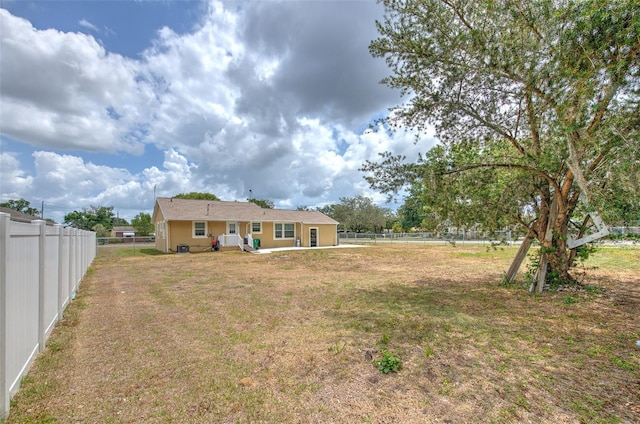 5939 14th St, Zephyrhills, FL 33542 - view of yard with a patio and a fenced backyard