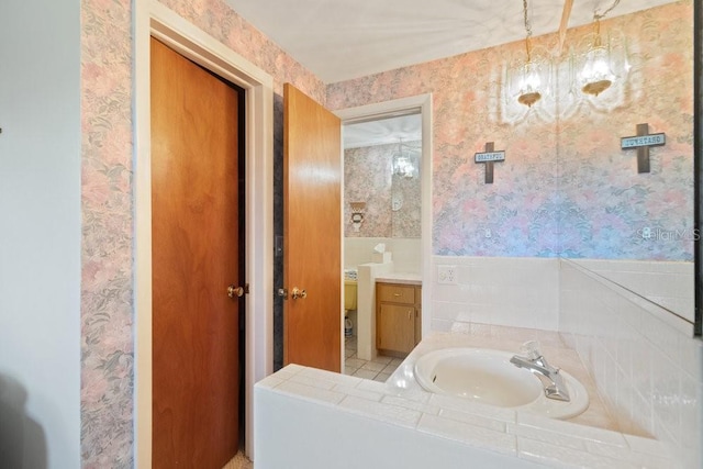7534 Culberson Dr, Port Richey, FL 34668 - bathroom with vanity and wallpapered walls