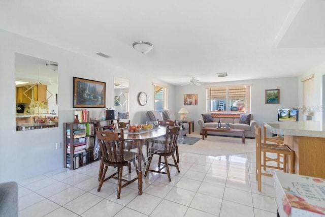 7534 Culberson Dr, Port Richey, FL 34668 - dining space featuring visible vents, ceiling fan, and light tile patterned floors