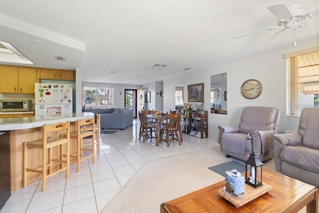 7534 Culberson Dr, Port Richey, FL 34668 - living area featuring visible vents, ceiling fan, a toaster, and light tile patterned flooring