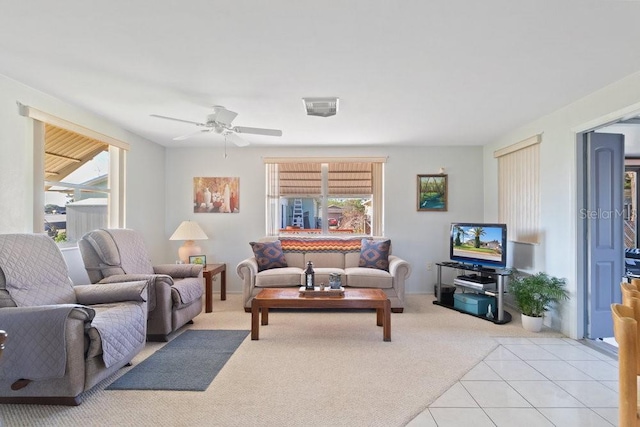 7534 Culberson Dr, Port Richey, FL 34668 - carpeted living room with ceiling fan, tile patterned floors, and a wealth of natural light