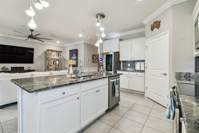 kitchen featuring a ceiling fan, light tile patterned flooring, open floor plan, a sink, and stainless steel appliances