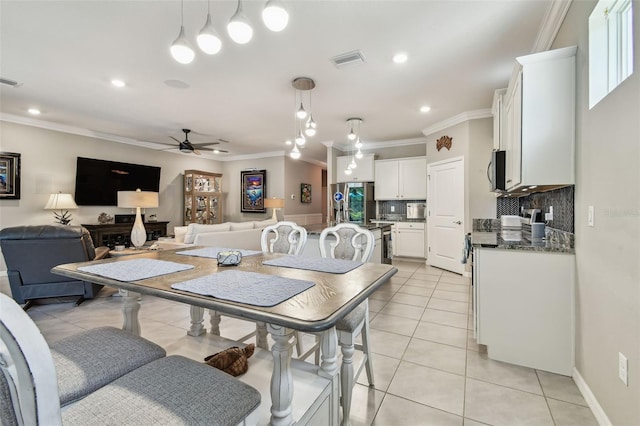 dining room featuring a ceiling fan, visible vents, light tile patterned floors, ornamental molding, and recessed lighting