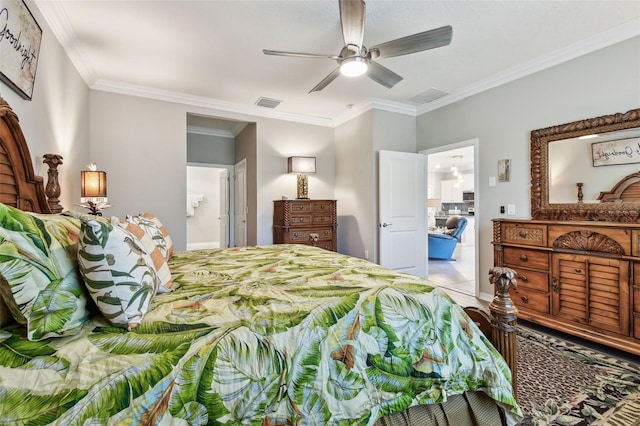 bedroom featuring crown molding, ceiling fan, and visible vents