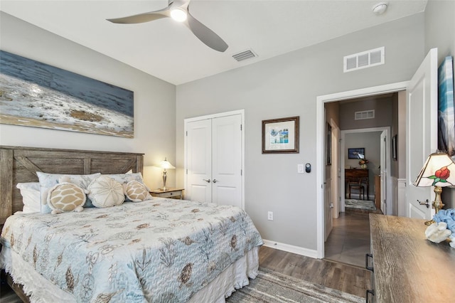 bedroom featuring visible vents, wood finished floors, and a closet