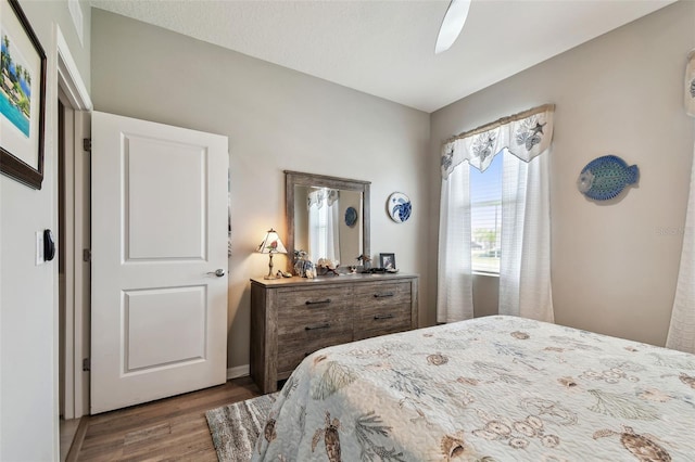 bedroom featuring ceiling fan and wood finished floors