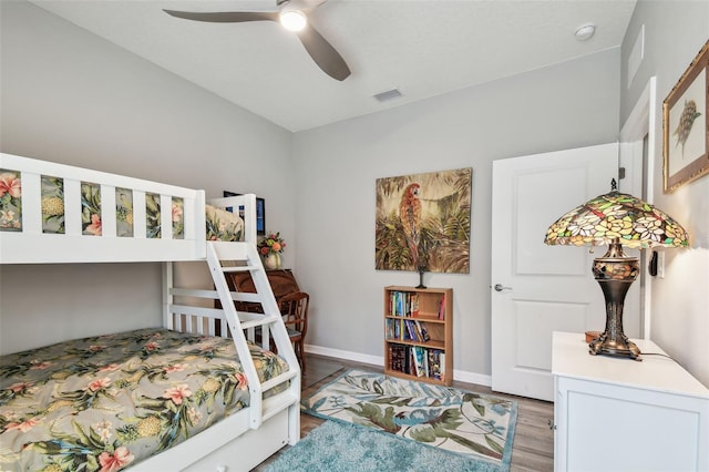 bedroom featuring baseboards, a ceiling fan, light wood finished floors, and visible vents