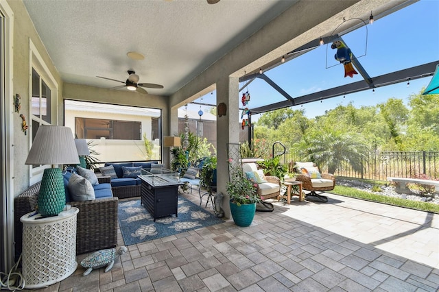 view of patio with a fenced backyard, a ceiling fan, and outdoor lounge area